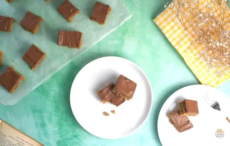 Homemade chocolate flapjack squares served on a plate